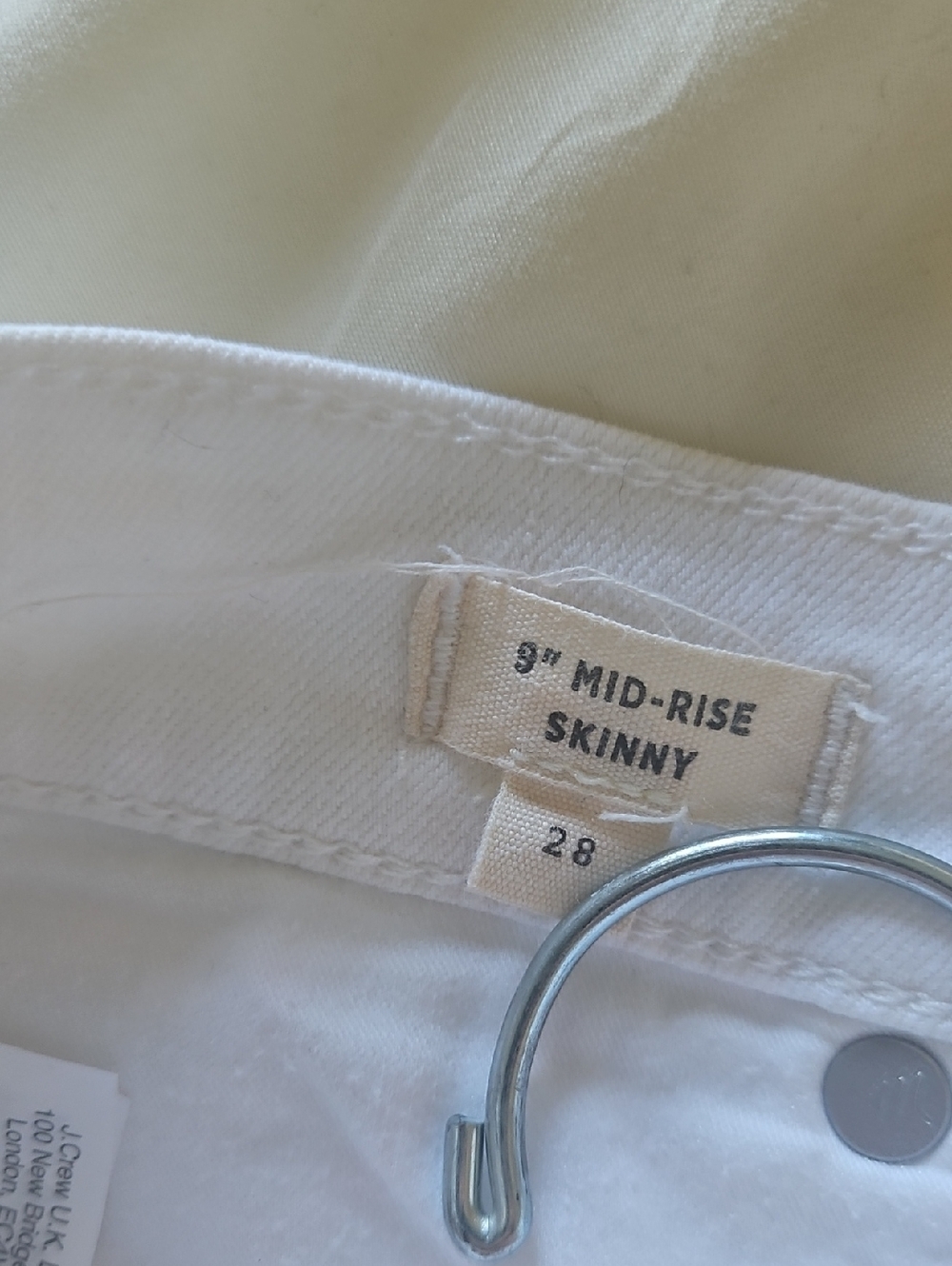 Mid -Rise White Button-Front Skinny Jeans - Picture 5 of 8